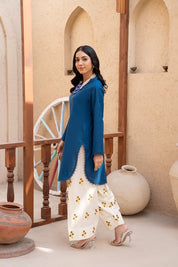 Blue top with white trouser